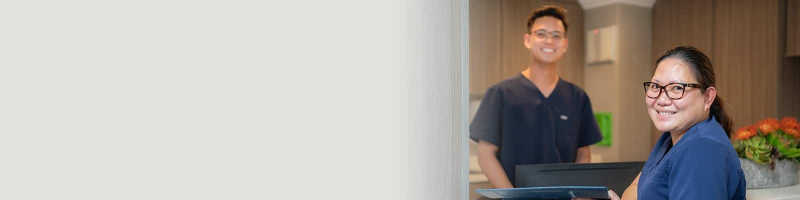 Two nurses standing at the nurses' station at Victorian post acute